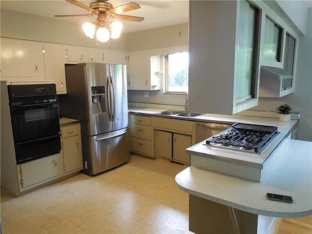 1118 Fairlane Dr, Hopewell Twp Bea, PA 15001 - kitchen with appliances with stainless steel finishes, a sink, a warming drawer, ceiling fan, and a peninsula