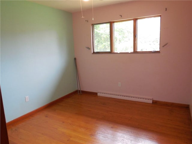 1118 Fairlane Dr, Hopewell Twp Bea, PA 15001 - unfurnished room with a baseboard radiator, light wood-type flooring, and baseboards