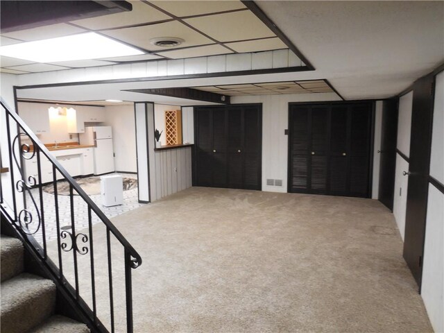 1118 Fairlane Dr, Hopewell Twp Bea, PA 15001 - finished below grade area featuring freestanding refrigerator, carpet, and stairs