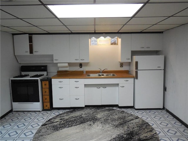 1118 Fairlane Dr, Hopewell Twp Bea, PA 15001 - kitchen with range with gas cooktop, freestanding refrigerator, a sink, under cabinet range hood, and a paneled ceiling