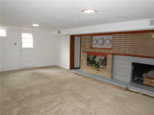 1118 Fairlane Dr, Hopewell Twp Bea, PA 15001 - unfurnished living room featuring a brick fireplace and carpet flooring