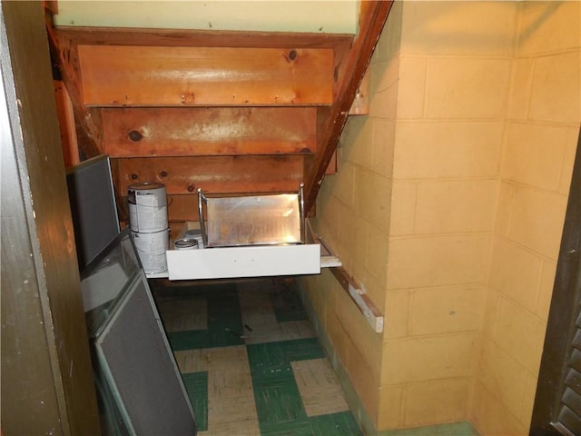 1118 Fairlane Dr, Hopewell Twp Bea, PA 15001 - staircase featuring concrete block wall