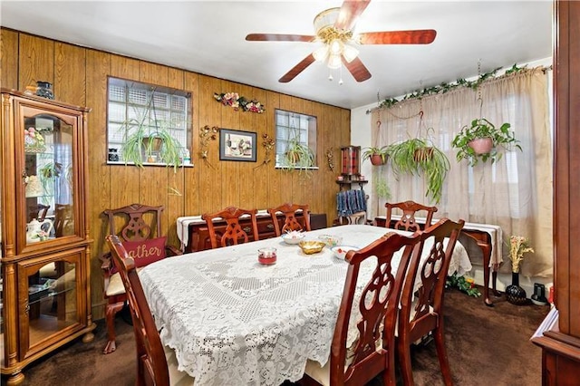 1405 Bellaire Pl, Brookline, PA 15226 - dining space featuring dark carpet, a ceiling fan, and wooden walls