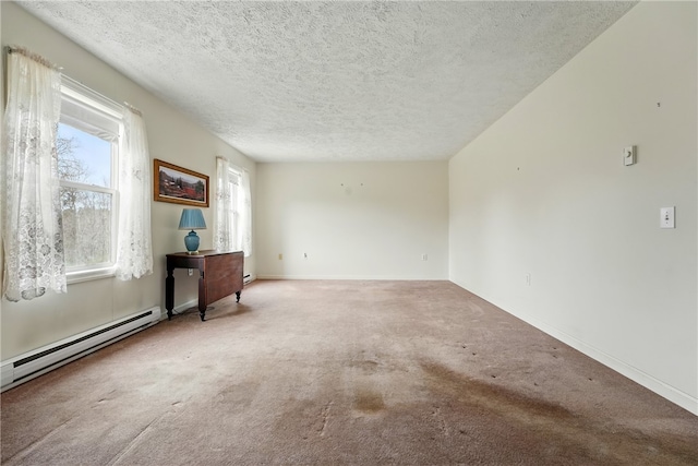 2002 Pulaski Rd, Neshannock Twp, PA 16105 - carpeted empty room featuring a textured ceiling, a baseboard heating unit, and baseboards