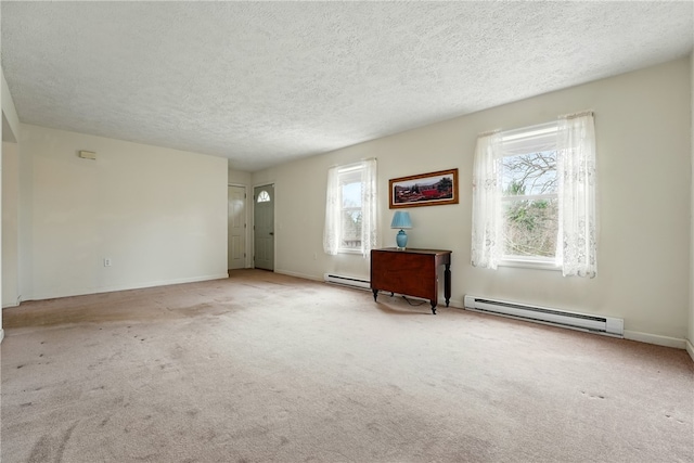 2002 Pulaski Rd, Neshannock Twp, PA 16105 - carpeted empty room with a baseboard radiator, a textured ceiling, and baseboards