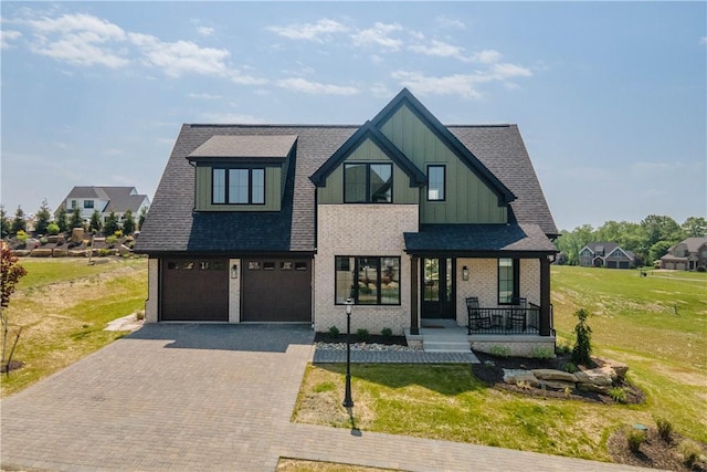 1062 Colony Dr, Collier Twp, PA 15205 - view of front of house featuring board and batten siding, a porch, decorative driveway, and a front lawn