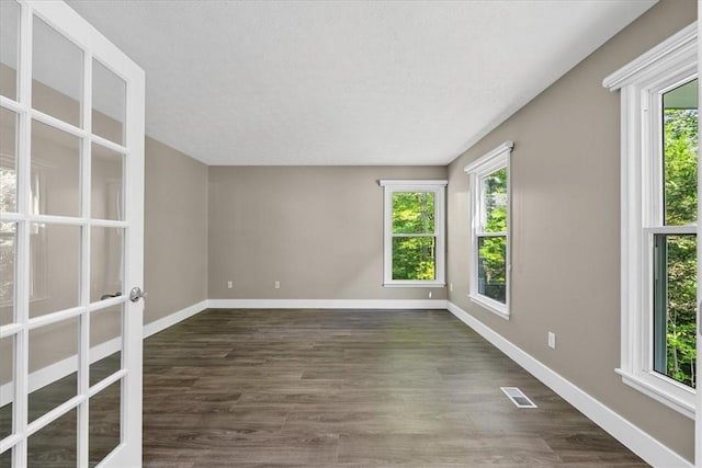 14 Laurel Hill Rd, Cecil, PA 15057 - spare room featuring healthy amount of natural light, french doors, baseboards, and dark wood-style floors