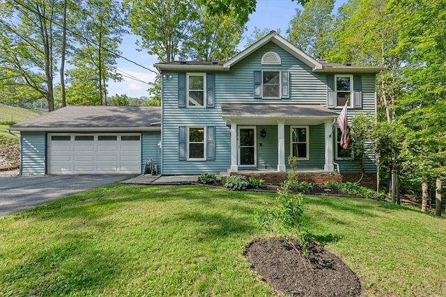 14 Laurel Hill Rd, Cecil, PA 15057 - traditional home with asphalt driveway, a garage, a porch, and a front yard