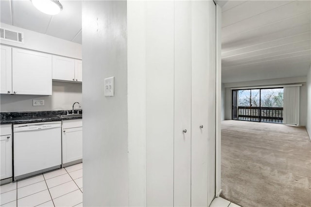 2034 Swallow Hill Rd Unit 403, Pittsburgh, PA 15220 - kitchen featuring white dishwasher, dark countertops, a sink, white cabinetry, and light colored carpet
