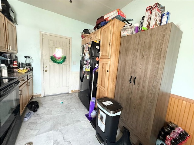 628 Superior St, New Castle/4Th, PA 16101 - kitchen featuring black appliances, wainscoting, and dark countertops