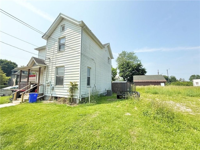 628 Superior St, New Castle/4Th, PA 16101 - view of side of home with central air condition unit and a yard