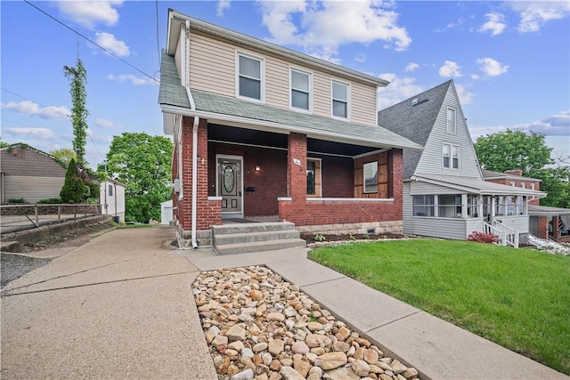 10 Amherst Ave, West View, PA 15229 - view of front of house with brick siding, a porch, a front lawn, and roof with shingles