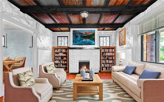 10 Amherst Ave, West View, PA 15229 - living area featuring wood finished floors, a brick fireplace, and beam ceiling