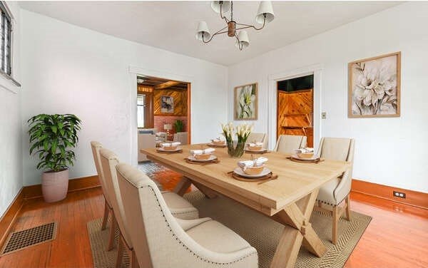 10 Amherst Ave, West View, PA 15229 - dining space featuring wood finished floors, a chandelier, and baseboards