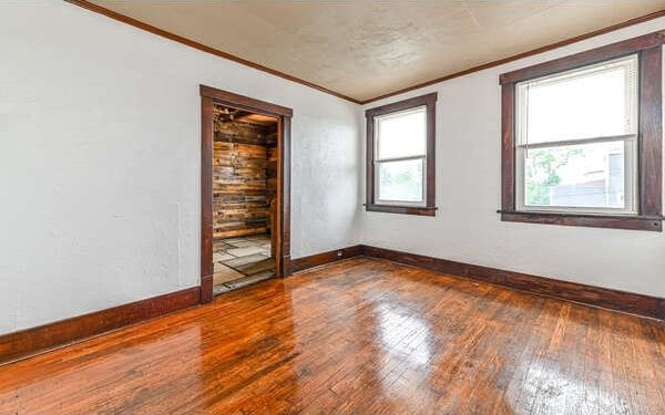 10 Amherst Ave, West View, PA 15229 - unfurnished room with ornamental molding, baseboards, and dark wood-style floors