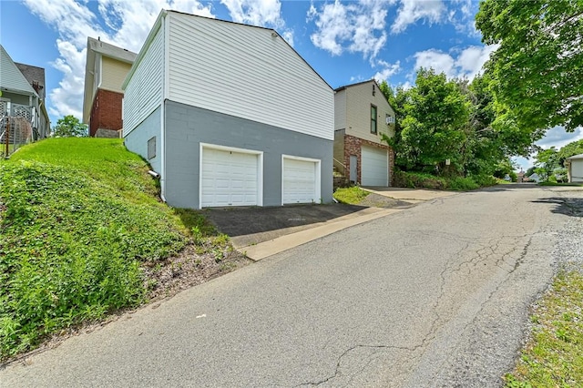 10 Amherst Ave, West View, PA 15229 - view of side of home with an attached garage and driveway