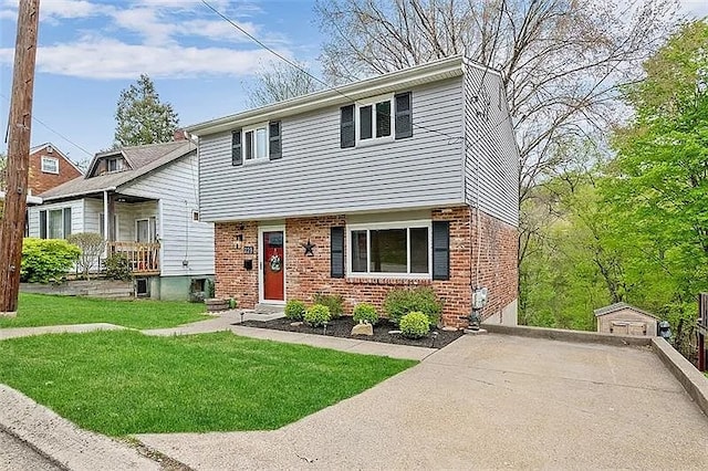 229 Conson Rd, Brentwood, PA 15227 - view of front of property featuring brick siding and a front lawn