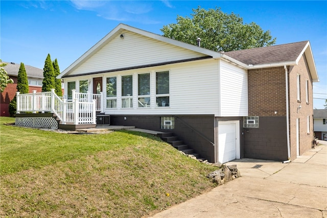 11660 Dennis Cir N, Huntingdon, PA 15642 - view of front of property featuring stairway, an attached garage, driveway, a wooden deck, and a front yard
