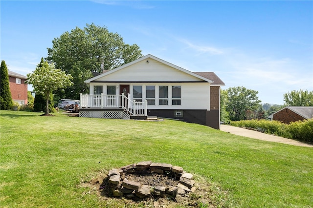 11660 Dennis Cir N, Huntingdon, PA 15642 - back of house with an outdoor fire pit, a yard, and a deck