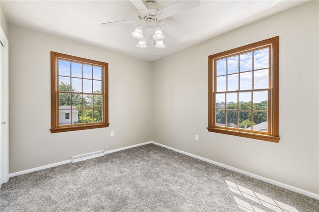 11660 Dennis Cir N, Huntingdon, PA 15642 - unfurnished room featuring plenty of natural light, carpet, baseboards, and ceiling fan