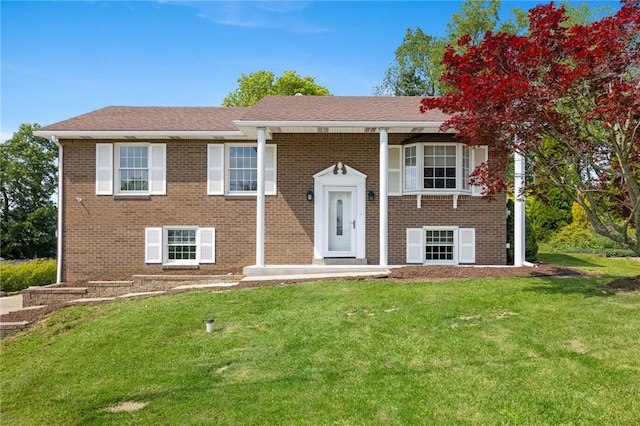 11660 Dennis Cir N, Huntingdon, PA 15642 - raised ranch featuring a front yard and brick siding