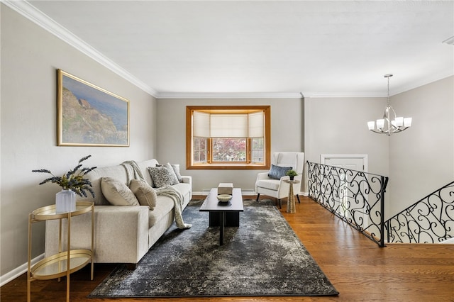 11660 Dennis Cir N, Huntingdon, PA 15642 - living room featuring a chandelier, wood finished floors, ornamental molding, and baseboards