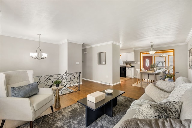 11660 Dennis Cir N, Huntingdon, PA 15642 - living room with a chandelier, dark wood finished floors, ornamental molding, and baseboards