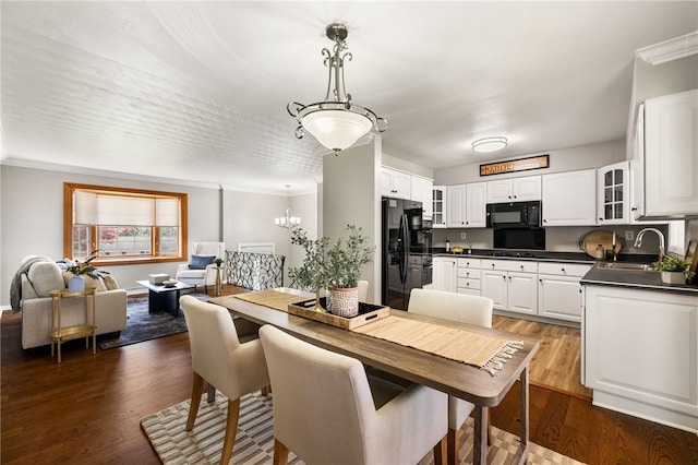 11660 Dennis Cir N, Huntingdon, PA 15642 - dining room with dark wood-style floors, ornamental molding, and a chandelier