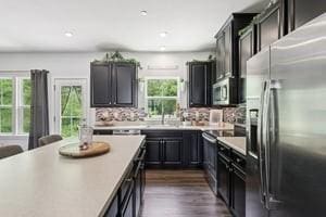 139 Moyer Hl, Cranberry Twp, PA 16066 - kitchen featuring appliances with stainless steel finishes, light countertops, dark wood-style flooring, and dark cabinets