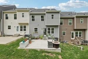 139 Moyer Hl, Cranberry Twp, PA 16066 - rear view of house with entry steps, a patio area, an outdoor fire pit, and a yard