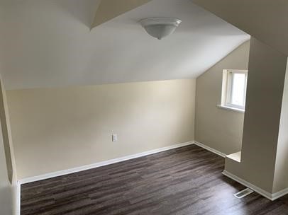 551-555 New Alexandria Rd, Hempfield Twp Wml, PA 15601 - bonus room featuring vaulted ceiling, dark wood-style flooring, and baseboards