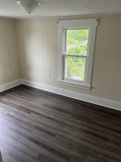 551-555 New Alexandria Rd, Hempfield Twp Wml, PA 15601 - empty room with baseboards and dark wood-style flooring