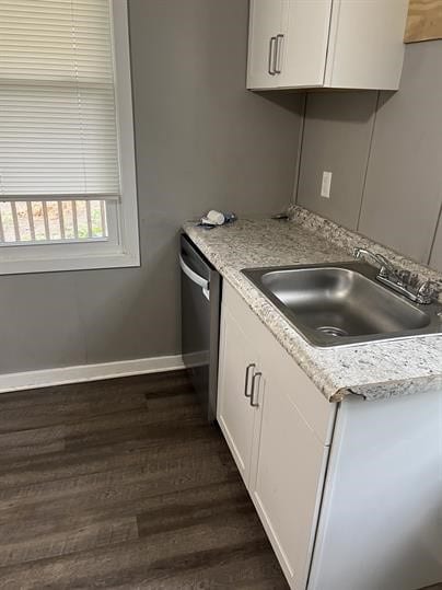 551-555 New Alexandria Rd, Hempfield Twp Wml, PA 15601 - kitchen with a sink, dishwasher, baseboards, dark wood-style flooring, and white cabinets