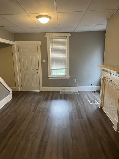 551-555 New Alexandria Rd, Hempfield Twp Wml, PA 15601 - unfurnished dining area featuring a drop ceiling, baseboards, and dark wood-style floors