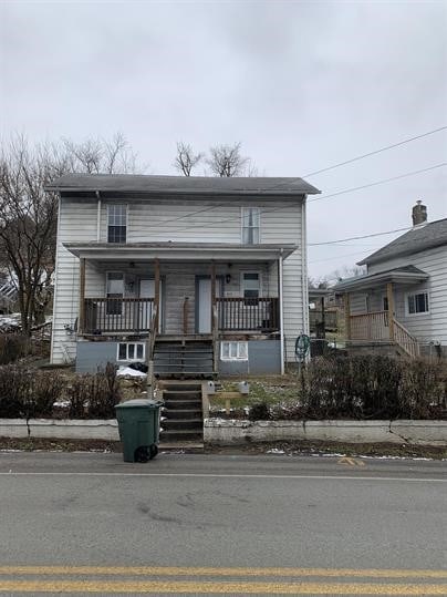 551-555 New Alexandria Rd, Hempfield Twp Wml, PA 15601 - view of front of property featuring stairway and a porch