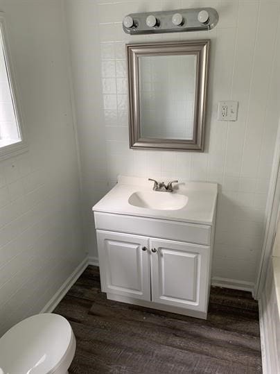 551-555 New Alexandria Rd, Hempfield Twp Wml, PA 15601 - bathroom with wood finished floors, vanity, and toilet