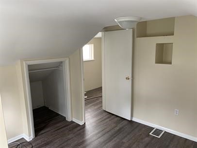 551-555 New Alexandria Rd, Hempfield Twp Wml, PA 15601 - bonus room featuring dark wood-style floors, vaulted ceiling, and baseboards