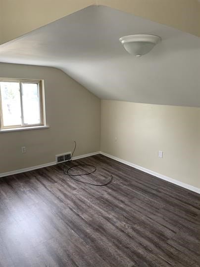 551-555 New Alexandria Rd, Hempfield Twp Wml, PA 15601 - additional living space featuring vaulted ceiling, dark wood-type flooring, and baseboards