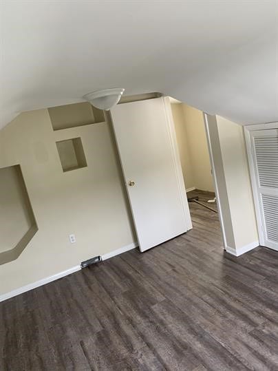 551-555 New Alexandria Rd, Hempfield Twp Wml, PA 15601 - unfurnished bedroom with dark wood-style floors, baseboards, and vaulted ceiling