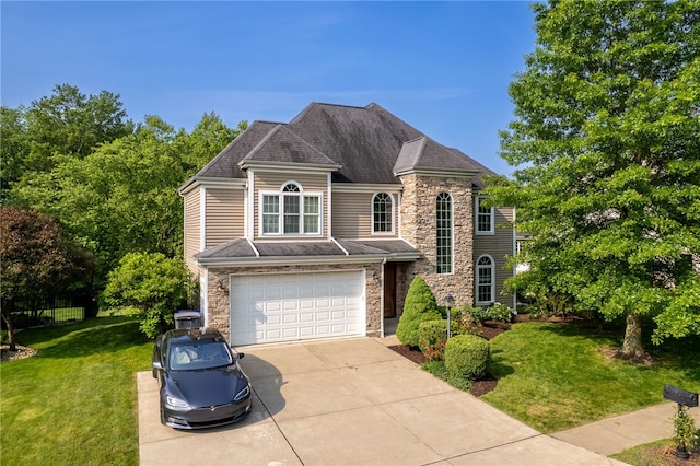 621 Columbia Ct, Adams Twp, PA 16046 - view of front of house featuring stone siding, driveway, an attached garage, and a front lawn