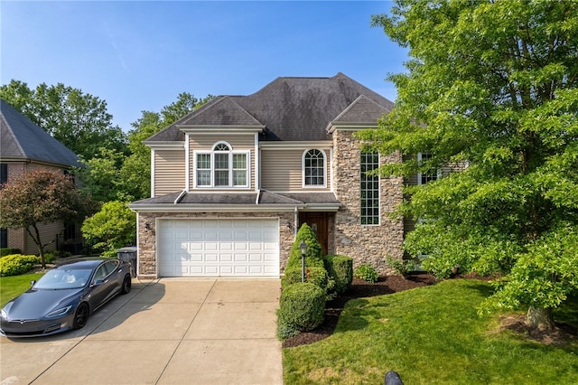 621 Columbia Ct, Adams Twp, PA 16046 - view of front facade with stone siding, driveway, an attached garage, and roof with shingles