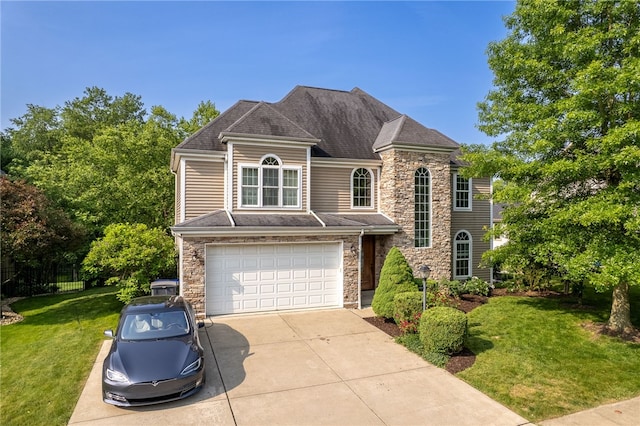 621 Columbia Ct, Adams Twp, PA 16046 - view of front of property featuring stone siding, concrete driveway, a front yard, and a garage