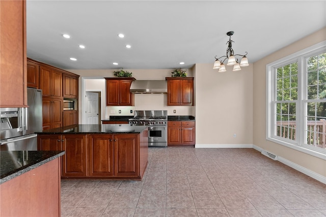 621 Columbia Ct, Adams Twp, PA 16046 - kitchen with appliances with stainless steel finishes, wall chimney exhaust hood, recessed lighting, baseboards, and light tile patterned floors
