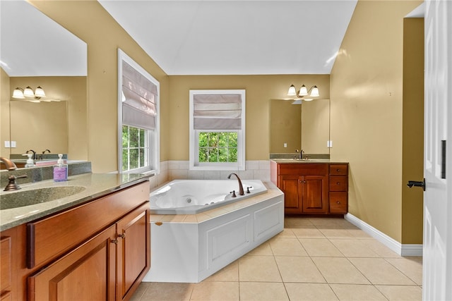 621 Columbia Ct, Adams Twp, PA 16046 - full bathroom featuring two vanities, a jetted tub, and tile patterned floors
