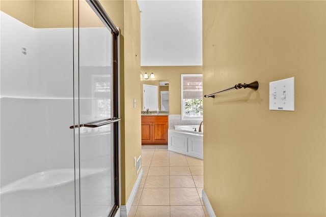 621 Columbia Ct, Adams Twp, PA 16046 - full bath featuring tile patterned floors, a shower stall, vanity, a bath, and baseboards