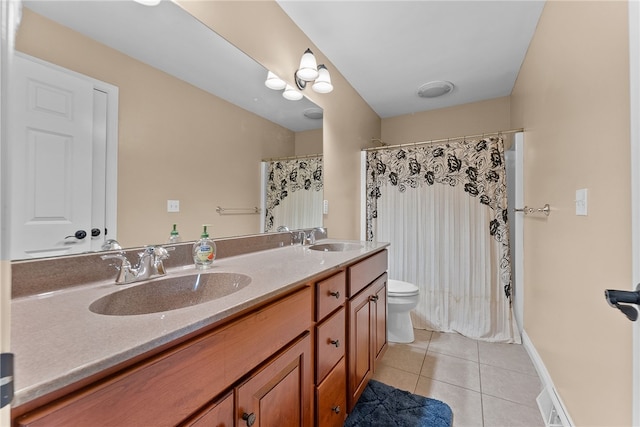 621 Columbia Ct, Adams Twp, PA 16046 - full bath with toilet, tile patterned floors, double vanity, a shower with curtain, and baseboards
