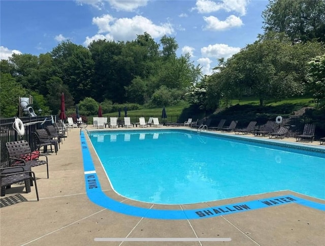 621 Columbia Ct, Adams Twp, PA 16046 - community pool featuring a patio area and view of wooded area