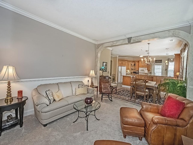 210 Adams Pointe Blvd Unit 6, Adams Twp, PA 16046 - living room featuring arched walkways, ornamental molding, a chandelier, and light carpet