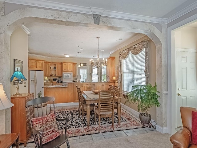 210 Adams Pointe Blvd Unit 6, Adams Twp, PA 16046 - dining space with arched walkways, crown molding, a chandelier, baseboards, and light tile patterned flooring