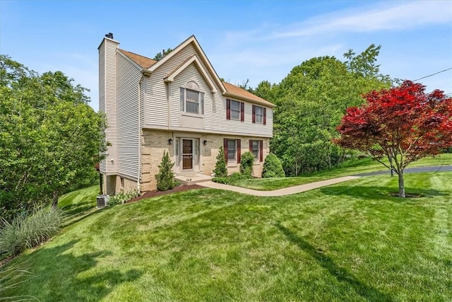 8963 Seneca Ave, Mccandless, PA 15237 - view of front facade with a chimney, a front lawn, and brick siding